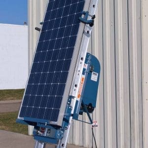 Platform hoist with solar panel attachment.